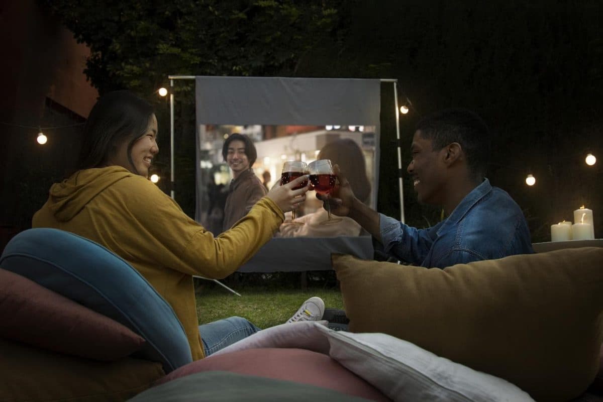 young-friends-having-fun-cinema-open-air