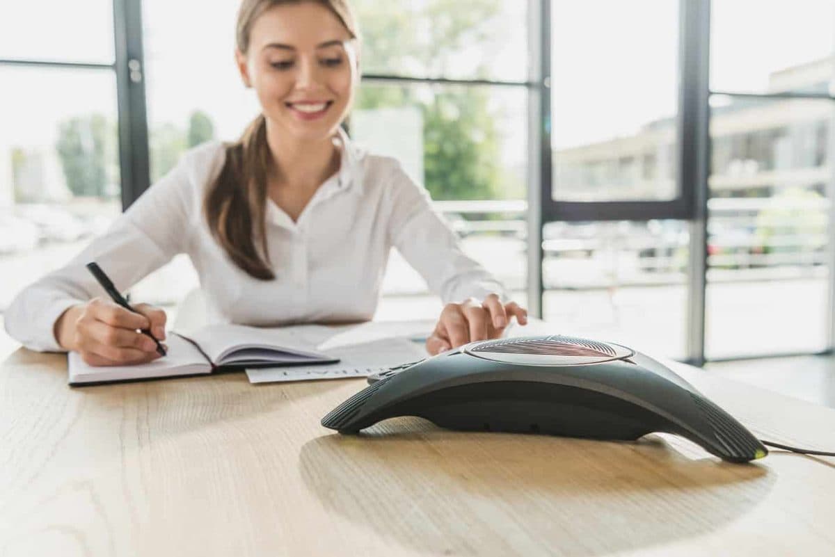 A person writing on a piece of paper Description automatically generated with medium confidence